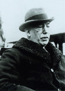 Northern Ireland prime minister Sir James Craig-in the background was the worsening situation in Northern Ireland. Two attempts by Collins to get Craig to reform the Northern Ireland government had already failed. (George Morrison)