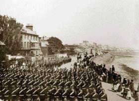 Carrickfergus was home to the locally raised Antrim Artillery, seen here forming up along the seafront in the early 1900s.