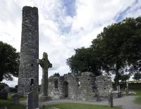 Monasterboice today and as depicted on the harp, not as ruins but with roofs. (Kevin King).