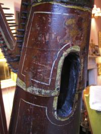 One of the three sound-holes in the rounded back soundbox. Note the addition of a thin iron band to prevent twisting: ‘[we have] by our improvement on the construction of the national instrument, given to it imperishable strength’—Fr Burke.