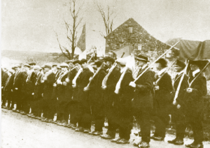 Early days—still without uniforms or weapons, Irish Volunteers drill with hurleys (date and location unknown). But how revolutionary were they?