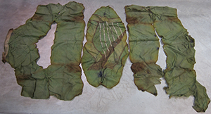 Above: The National Museum’s green harp flag. Earlier this year all the main pieces were laid out and examined, including by experts from the Garda Forensics Unit. Using the mirrored burn damage as a guide, the fact that this flag had been folded when it was burnt was clearly established. (NMI)